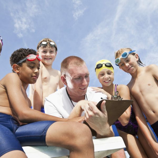 Coach talking to swim team