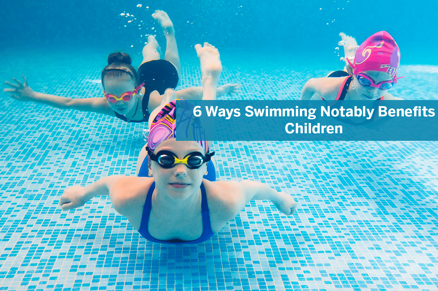 Three children swimming underwater in a pool.